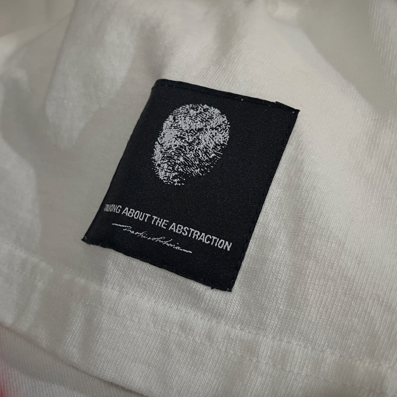 TALKING ABOUT THE ABSTRACTION 25SS SMOUDGE T-SHIRT バッククロス刺繍ギタープリントTシャツ カットソー Tee T-shirt トップス 未使用タグ付き NPT-T-007 定価24,200円 TATA トーキングアバウト ジ アブストラクション